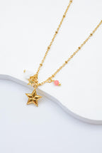 Collier avec pendentif étoile et petites décorations - ROSE