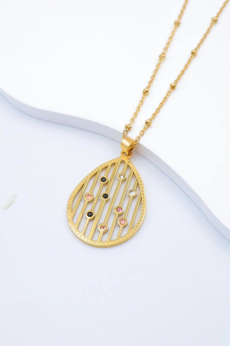 Collier avec pendentif ajouré et perles en cristal - DORÉ