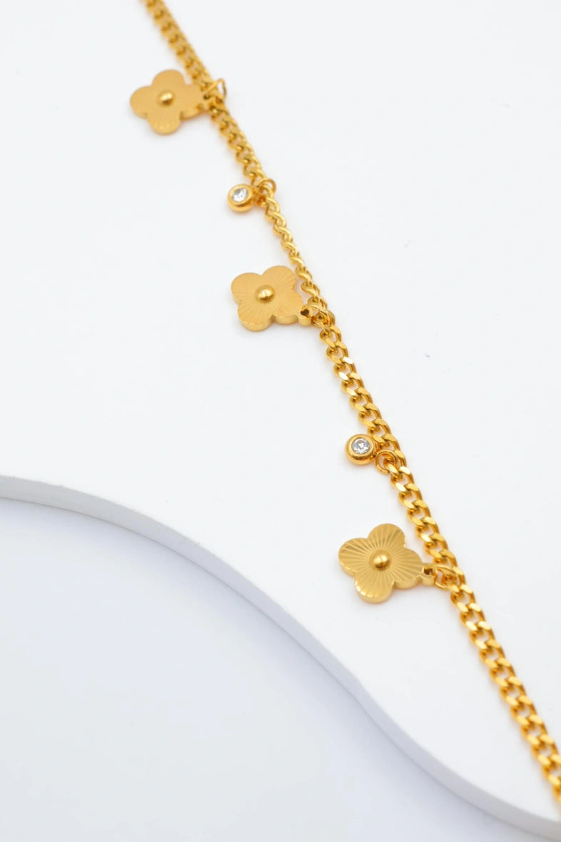 Bracelet avec motifs floraux et éléments circulaires intégrant des cristaux. - DORÉ