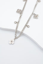 Collier avec motifs floraux et éléments circulaires intégrant des cristaux. - ARGENT
