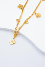 Collier avec motifs floraux et éléments circulaires intégrant des cristaux. - DORÉ