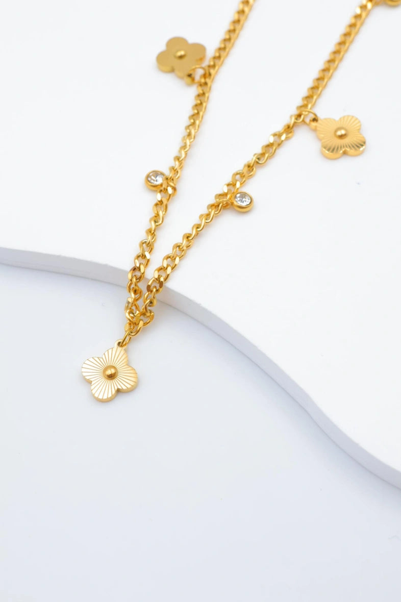Collier avec motifs floraux et éléments circulaires intégrant des cristaux. - DORÉ