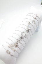 Lot de 12 bracelets en acier inoxydable avec coussin - ARGENT