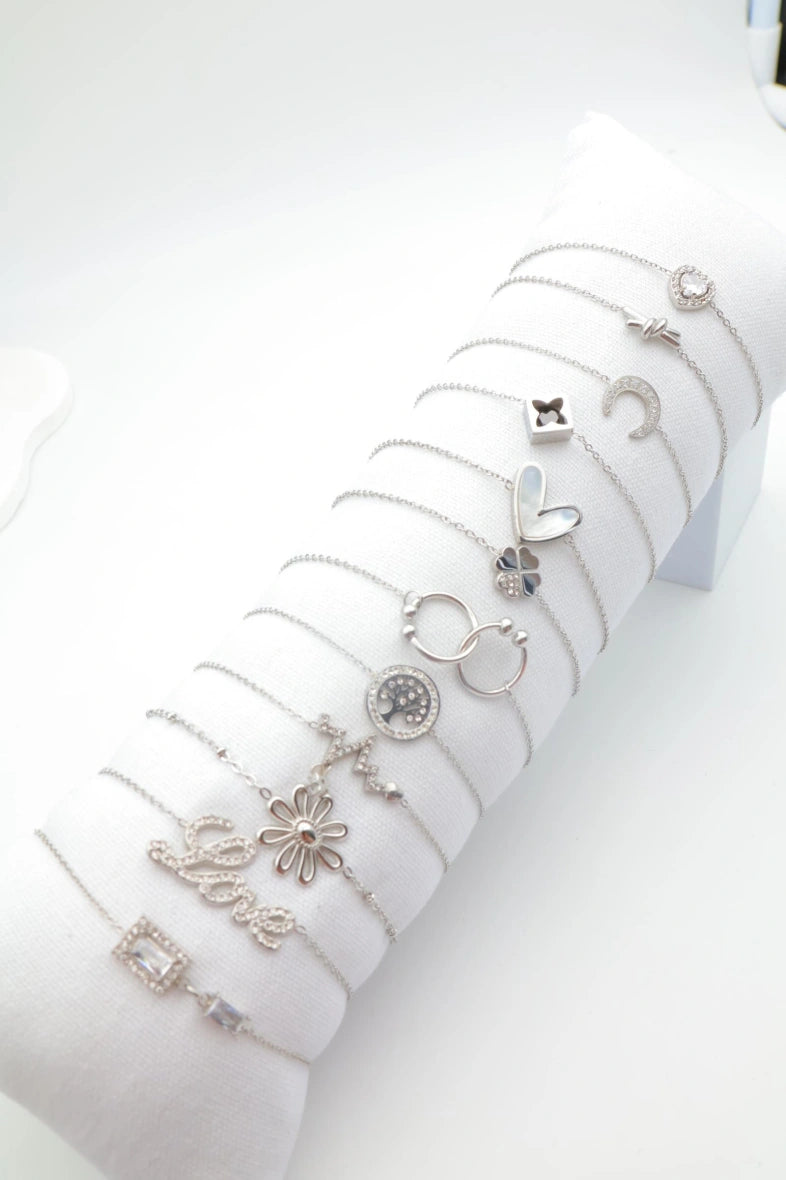 Lot de 12 bracelets en acier inoxydable avec coussin - ARGENT