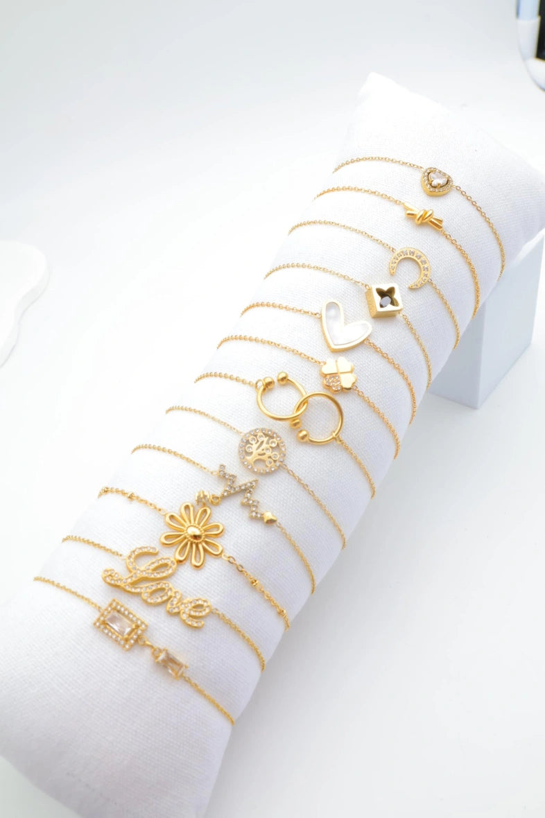 Lot de 12 bracelets en acier inoxydable avec coussin - DORÉ