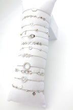 Lot de 12 bracelets en acier inoxydable avec coussin - ARGENT