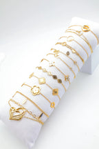 Lot de 12 bracelets en acier inoxydable avec coussin - DORÉ