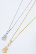 Collier avec pendentif en forme de violon orné de mini strass et d'un petit cristal. - DORÉ