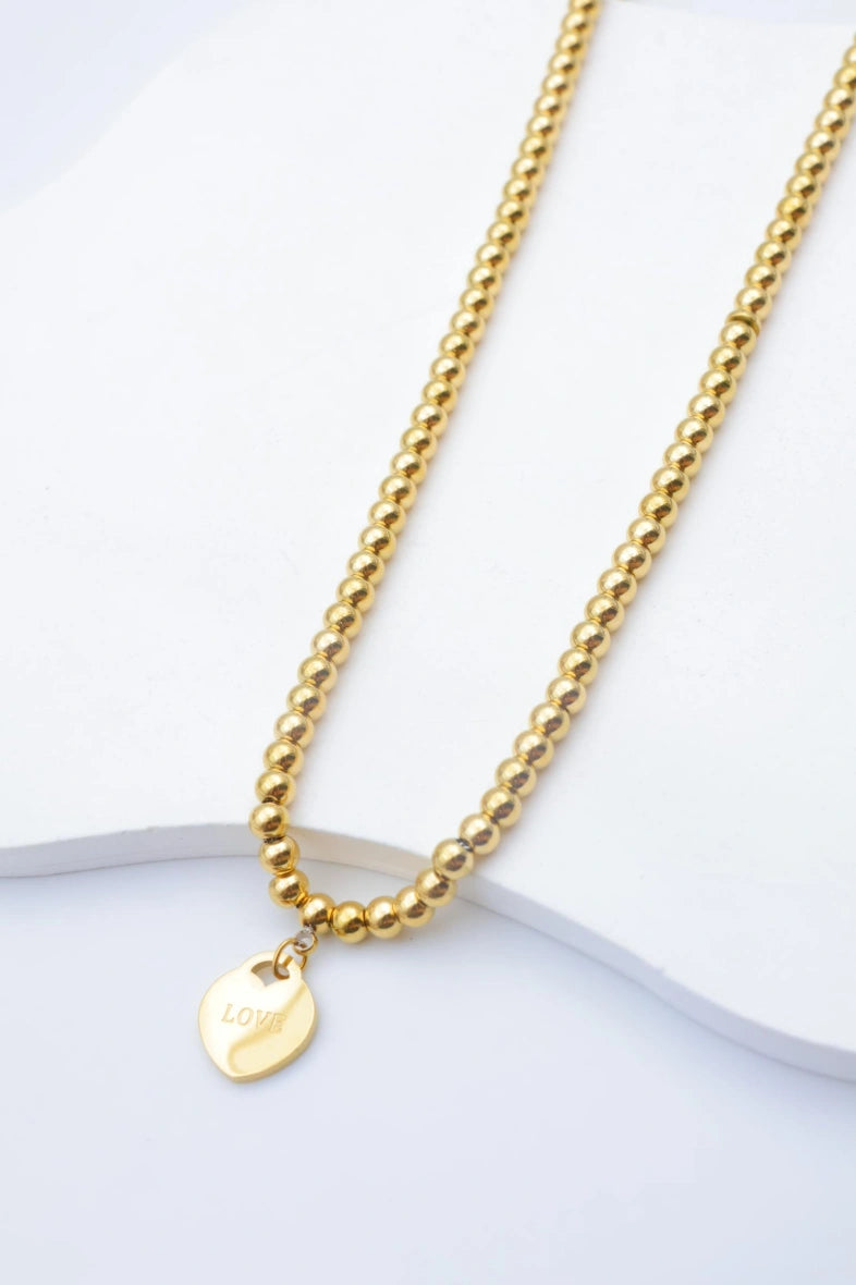 Collier à billes dorées avec pendentif "LOVE" - DORÉ