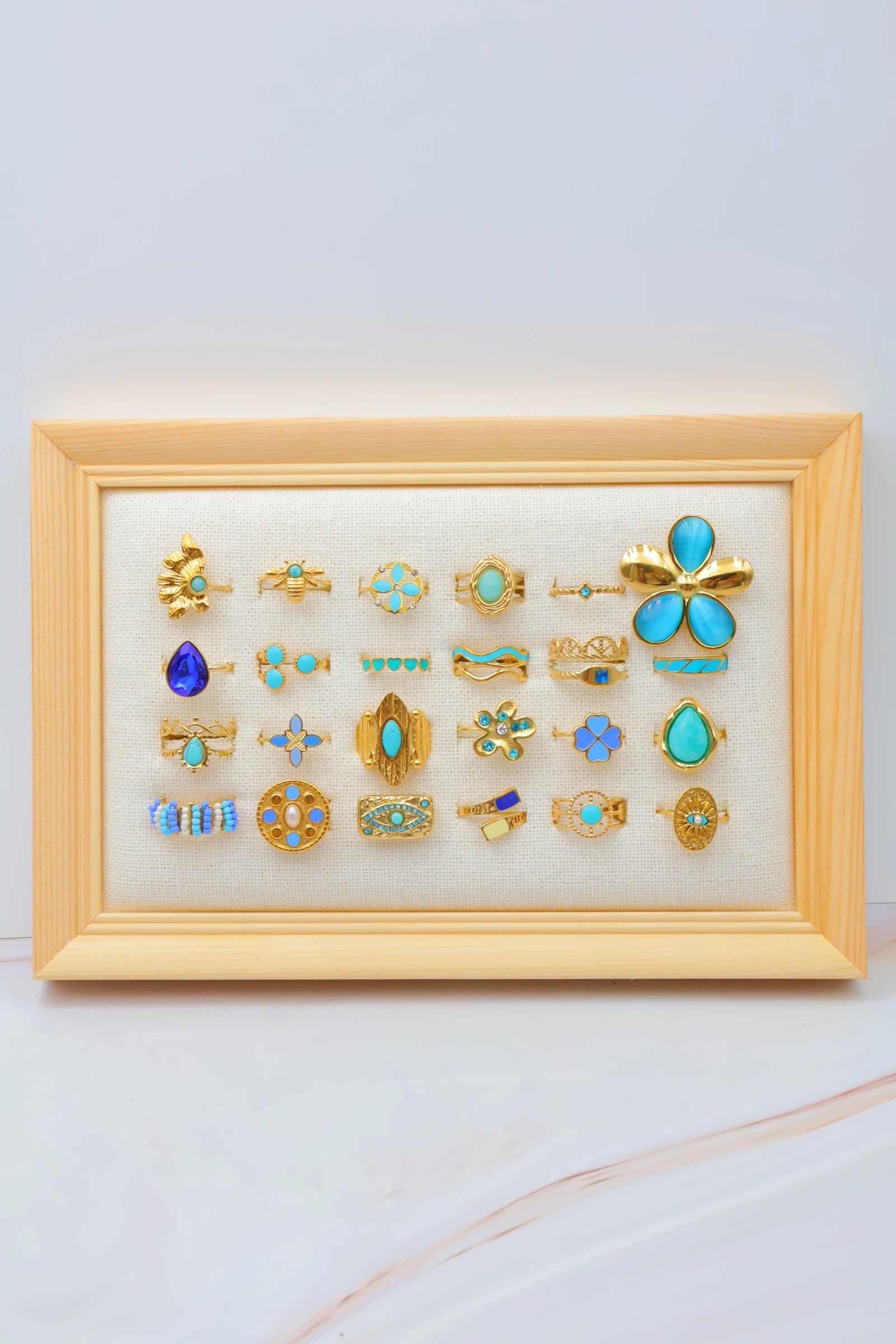 Lot de 24 bagues en acier inoxydable avec présentoir - BLEU